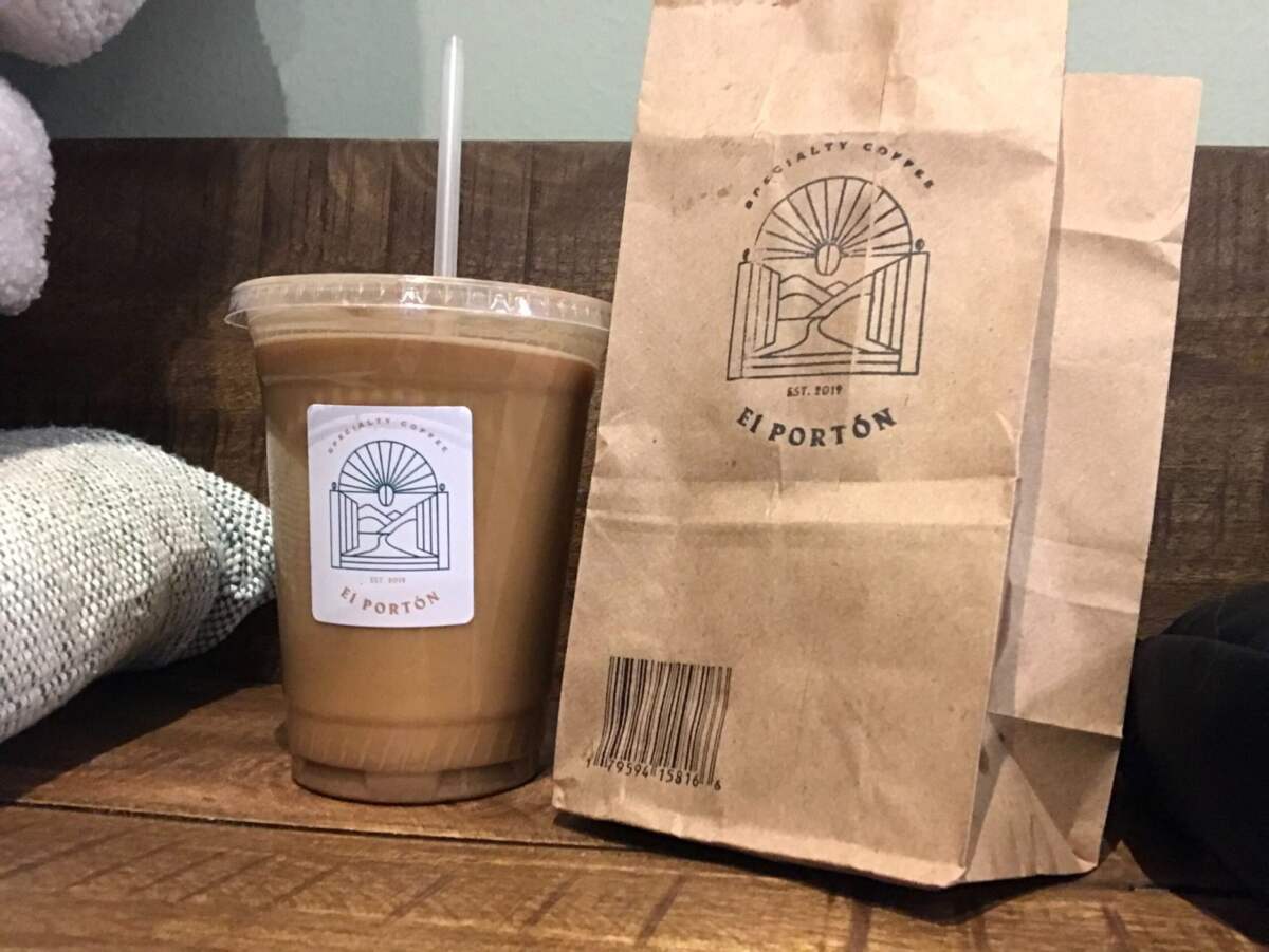 Iced coffee and a paper bag from a local coffee shop