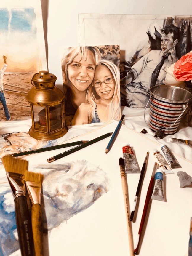 Painted portrait of two smiling women surrounded by paintbrushes and tubes of paint
